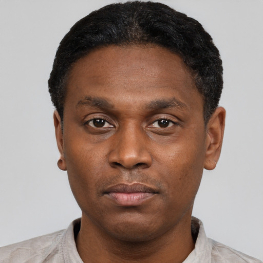 Neutral black young-adult male with short  black hair and brown eyes