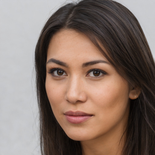 Neutral latino young-adult female with long  brown hair and brown eyes