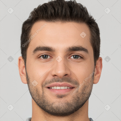 Joyful white young-adult male with short  brown hair and brown eyes