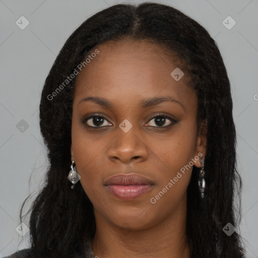 Joyful black young-adult female with long  black hair and brown eyes