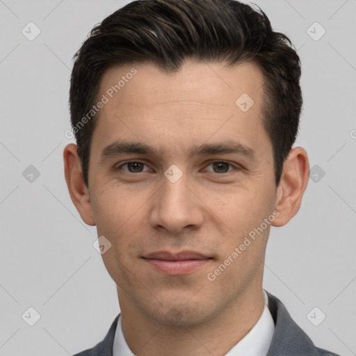 Joyful white young-adult male with short  black hair and brown eyes