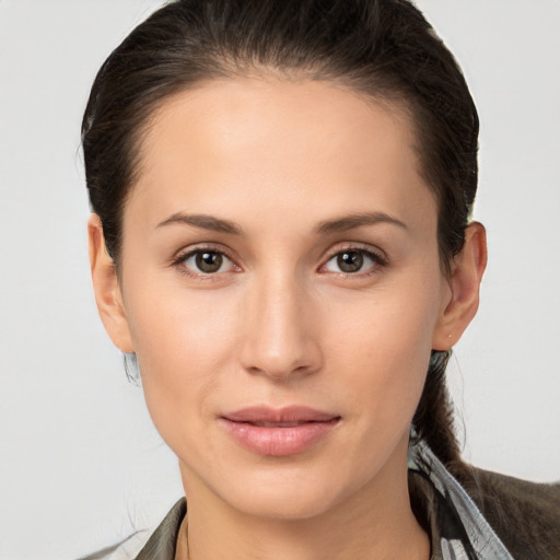 Joyful white young-adult female with medium  brown hair and brown eyes