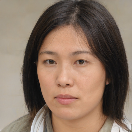 Neutral asian young-adult female with medium  brown hair and brown eyes