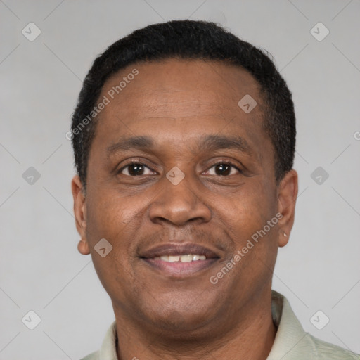 Joyful black adult male with short  brown hair and brown eyes