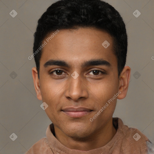 Joyful black young-adult male with short  black hair and brown eyes