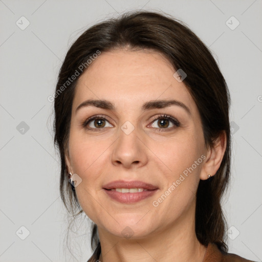 Joyful white adult female with medium  brown hair and brown eyes