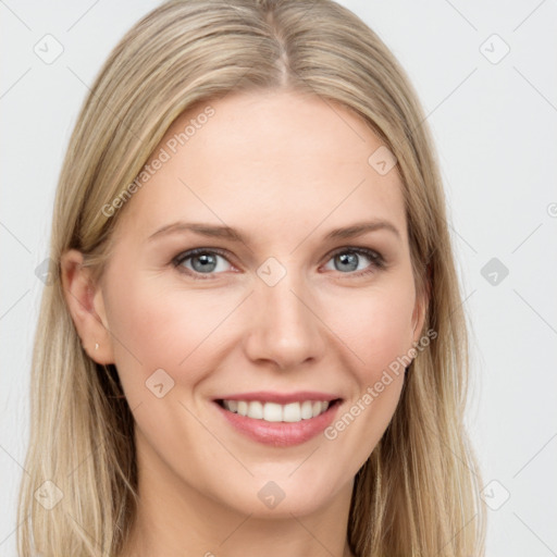 Joyful white young-adult female with long  brown hair and blue eyes