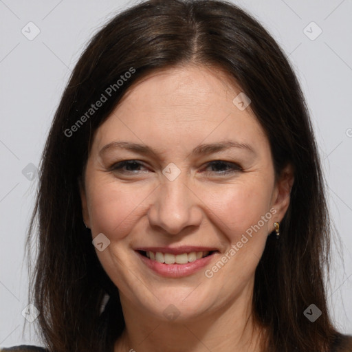 Joyful white adult female with medium  brown hair and brown eyes