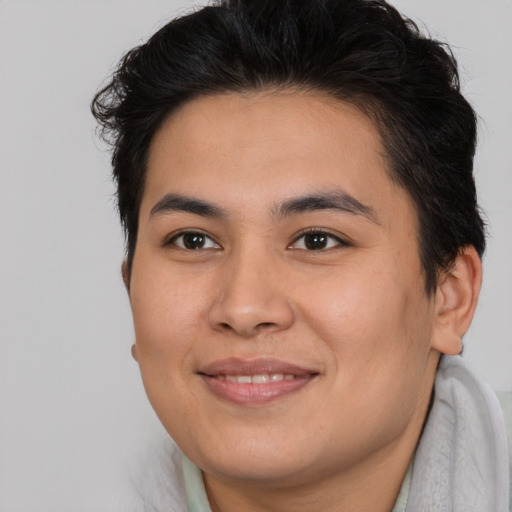 Joyful asian young-adult male with short  brown hair and brown eyes