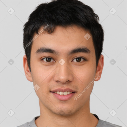 Joyful asian young-adult male with short  black hair and brown eyes