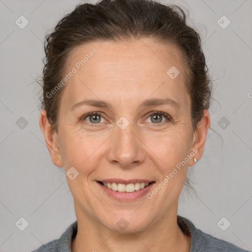 Joyful white adult female with short  brown hair and brown eyes