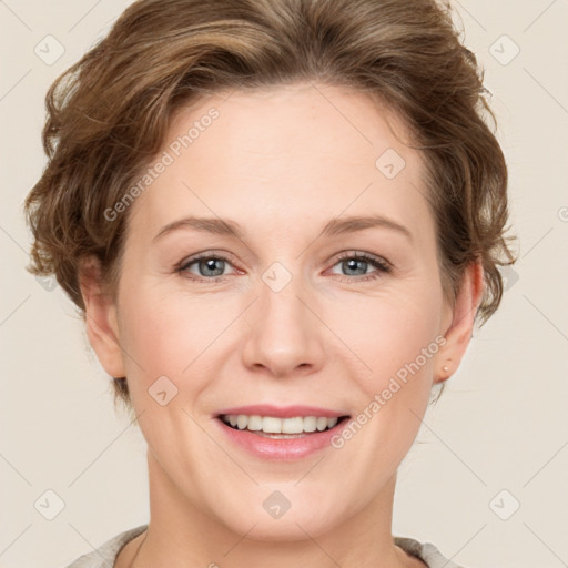 Joyful white adult female with short  brown hair and grey eyes