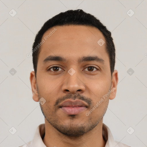Neutral latino young-adult male with short  black hair and brown eyes