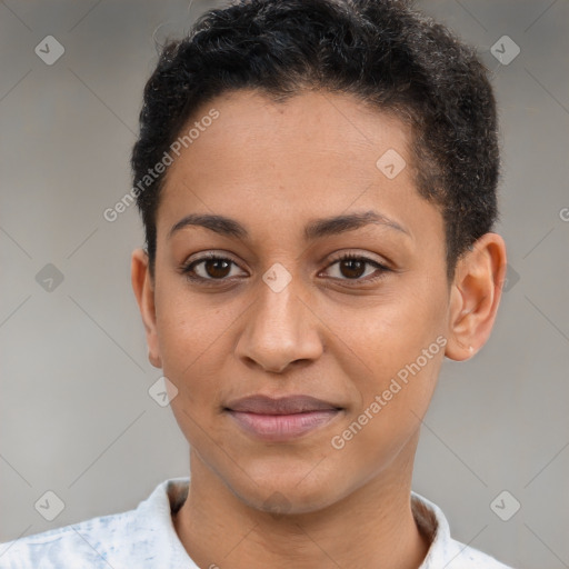 Joyful latino young-adult female with short  brown hair and brown eyes