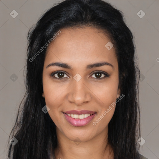 Joyful latino young-adult female with long  brown hair and brown eyes