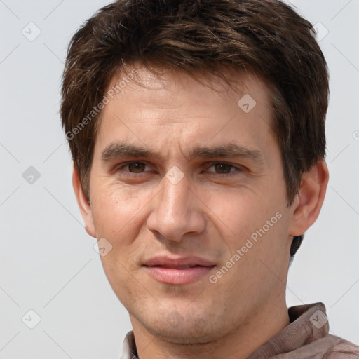 Joyful white adult male with short  brown hair and brown eyes