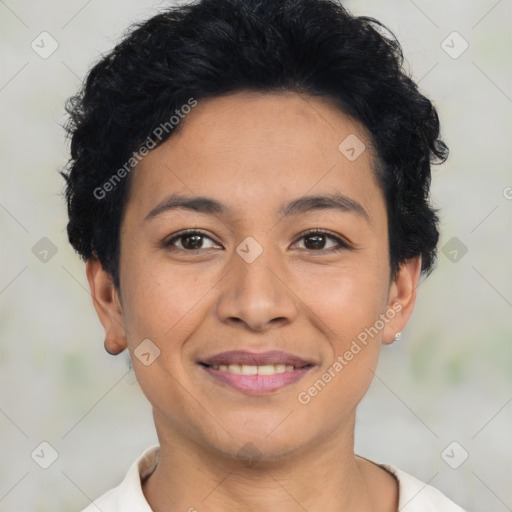 Joyful latino young-adult female with short  brown hair and brown eyes