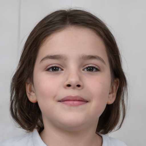 Joyful white child female with medium  brown hair and brown eyes