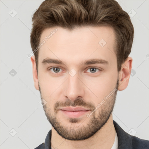 Neutral white young-adult male with short  brown hair and grey eyes