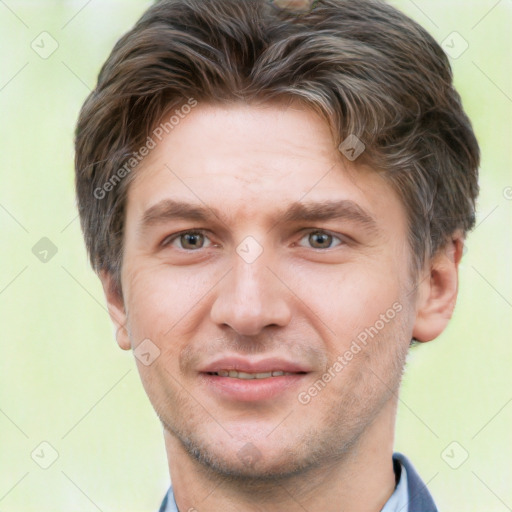 Joyful white adult male with short  brown hair and brown eyes