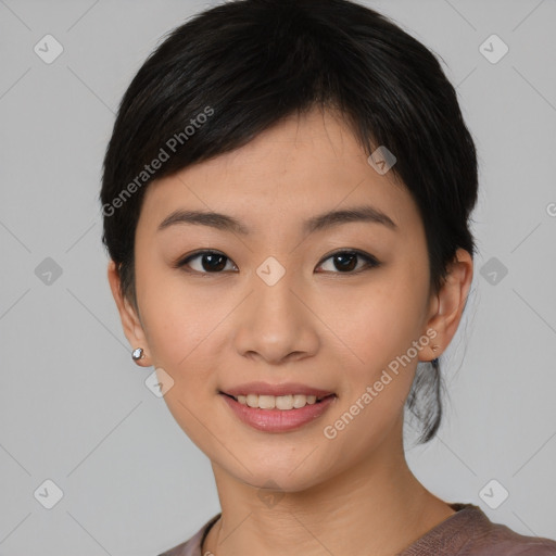 Joyful asian young-adult female with short  black hair and brown eyes