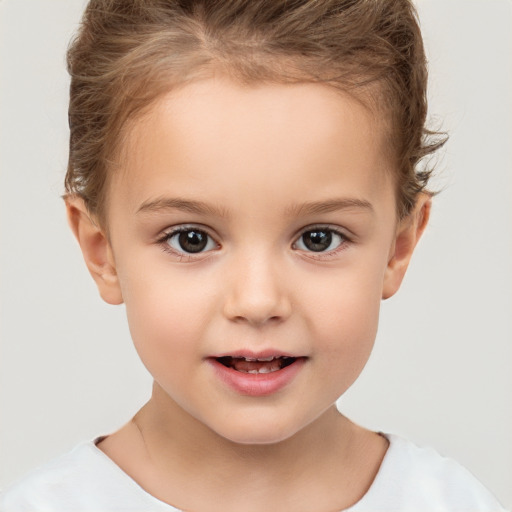 Joyful white child female with short  brown hair and brown eyes