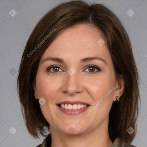 Joyful white adult female with medium  brown hair and grey eyes