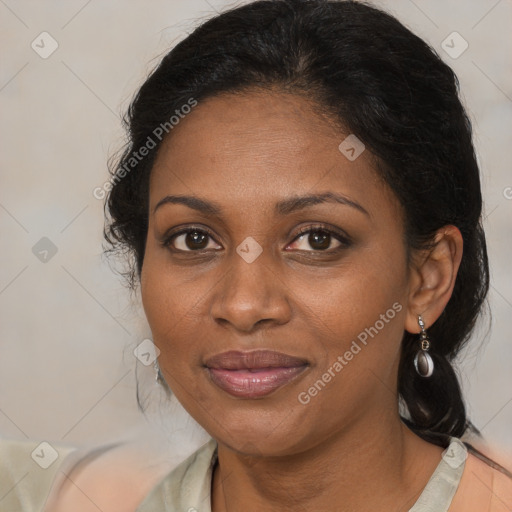 Joyful black adult female with medium  brown hair and brown eyes