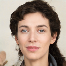 Joyful white young-adult female with medium  brown hair and green eyes