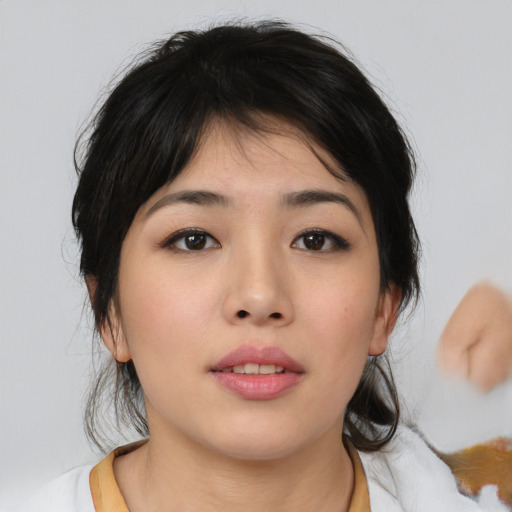 Neutral asian young-adult female with medium  brown hair and brown eyes