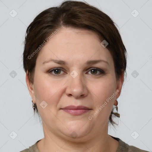 Joyful white adult female with short  brown hair and grey eyes