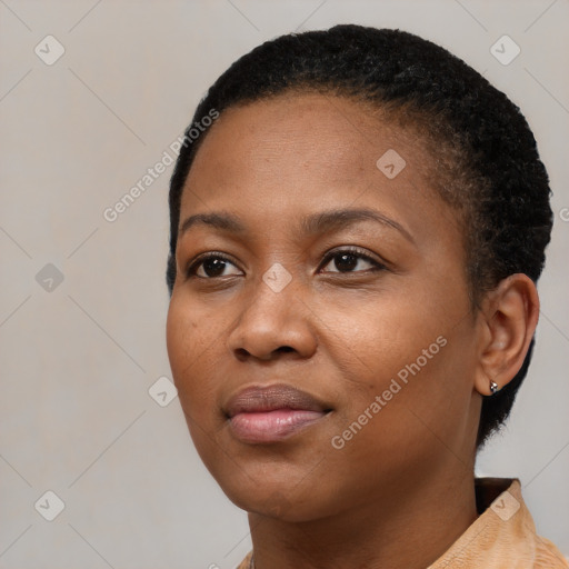 Joyful black young-adult female with short  black hair and brown eyes