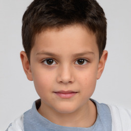 Joyful white child male with short  brown hair and brown eyes