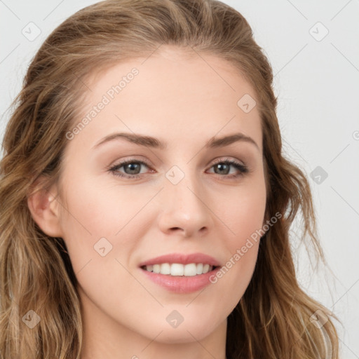 Joyful white young-adult female with long  brown hair and blue eyes