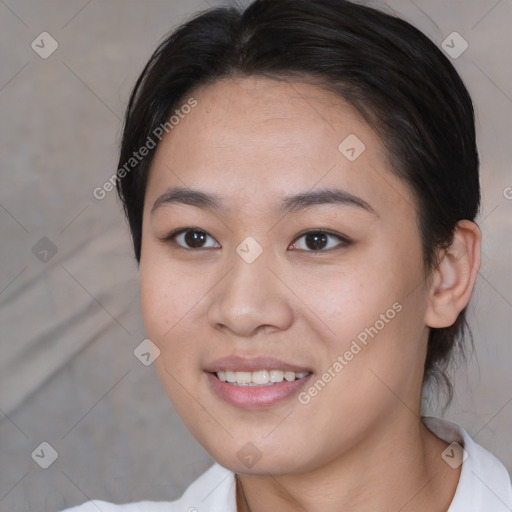 Joyful asian young-adult female with short  brown hair and brown eyes