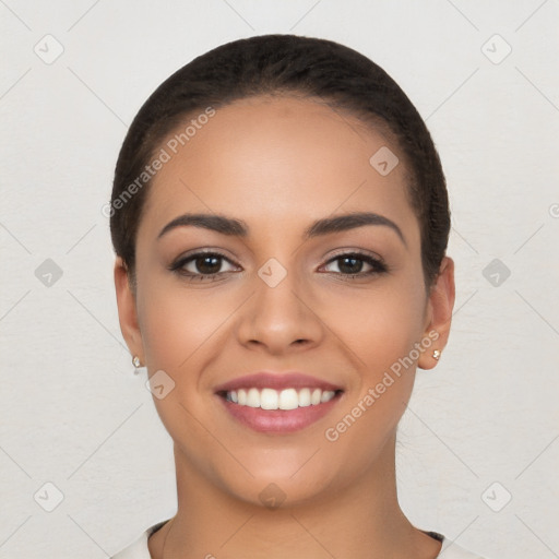 Joyful latino young-adult female with short  brown hair and brown eyes