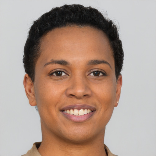 Joyful latino young-adult female with short  brown hair and brown eyes