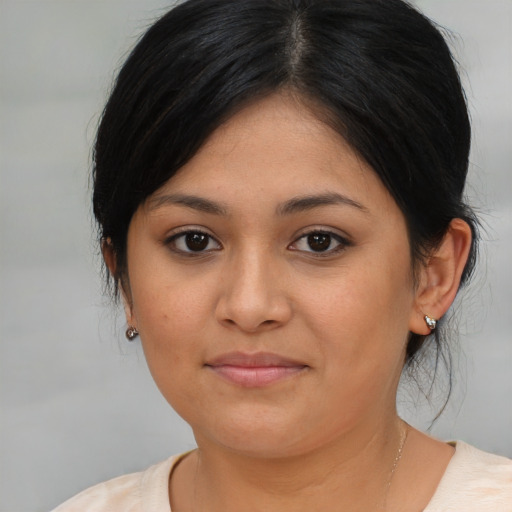 Joyful asian young-adult female with medium  brown hair and brown eyes