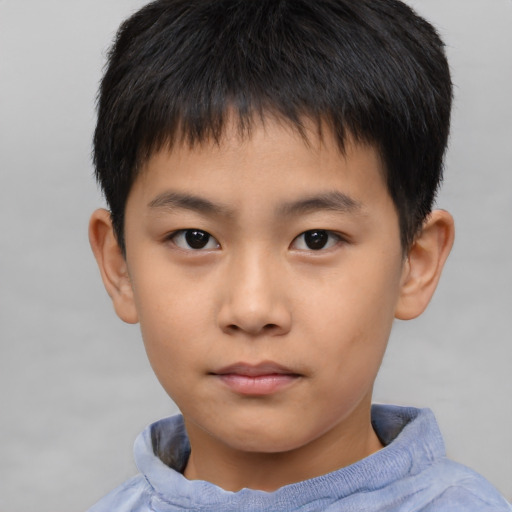 Neutral asian child male with short  brown hair and brown eyes