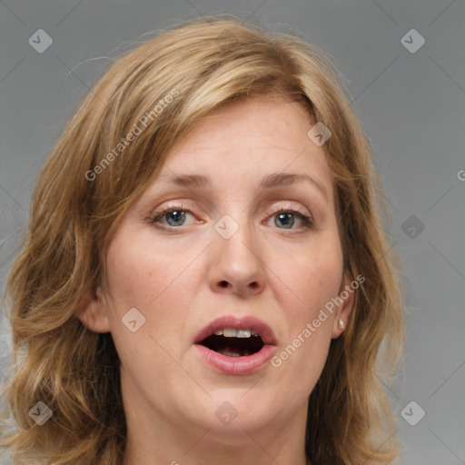 Joyful white young-adult female with medium  brown hair and blue eyes