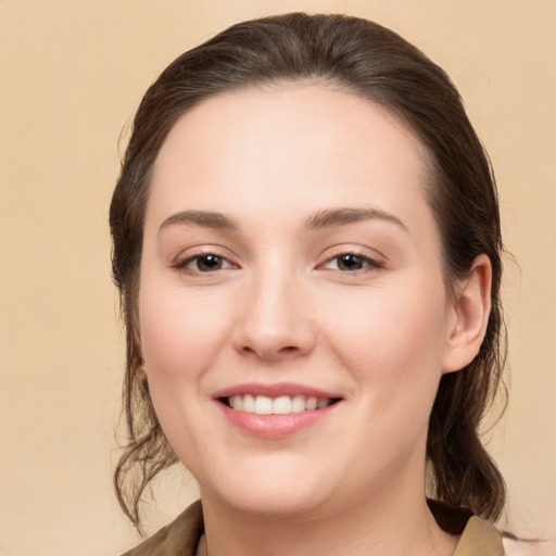 Joyful white young-adult female with medium  brown hair and brown eyes