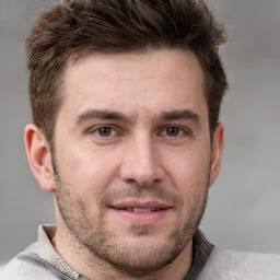 Joyful white adult male with short  brown hair and grey eyes