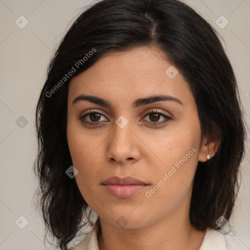 Joyful latino young-adult female with medium  brown hair and brown eyes