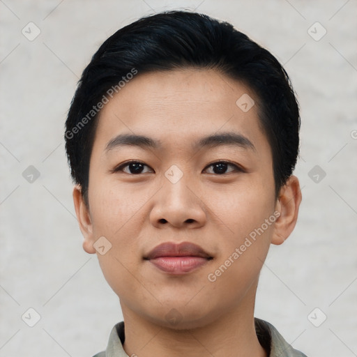 Joyful asian young-adult male with short  black hair and brown eyes