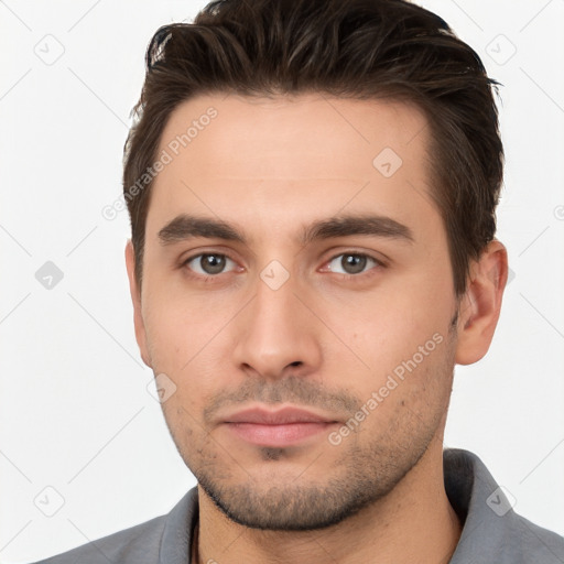 Neutral white young-adult male with short  brown hair and brown eyes