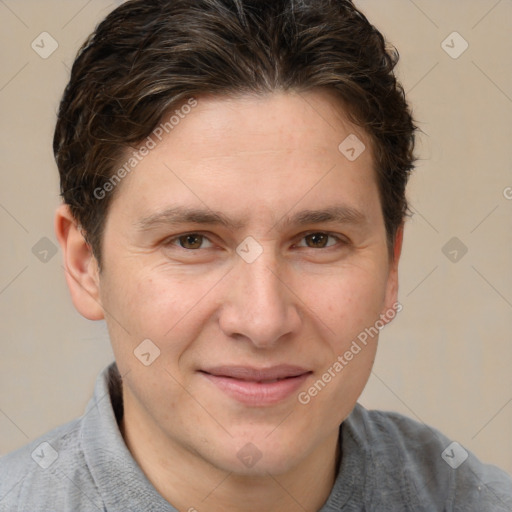 Joyful white adult male with short  brown hair and brown eyes