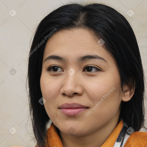 Joyful latino young-adult female with medium  brown hair and brown eyes