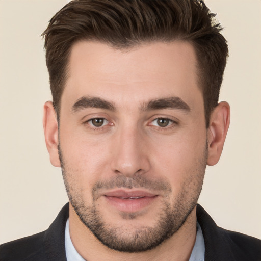 Joyful white young-adult male with short  brown hair and brown eyes