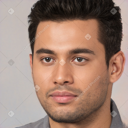 Neutral white young-adult male with short  brown hair and brown eyes