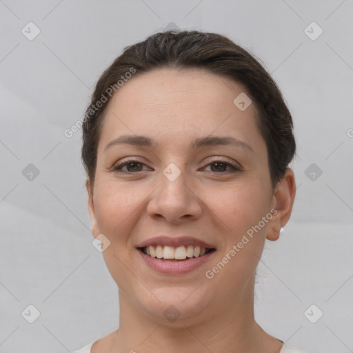 Joyful white young-adult female with short  brown hair and brown eyes